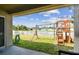 Fenced backyard with playset and grassy area at 6843 Runner Oak Dr, Wesley Chapel, FL 33545
