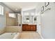 Bathroom with double vanity, soaking tub, and shower at 6843 Runner Oak Dr, Wesley Chapel, FL 33545