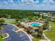Resort-style community pool with a clubhouse and surrounding amenities at 6843 Runner Oak Dr, Wesley Chapel, FL 33545
