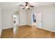 Spacious bedroom with wood flooring and access to bathroom at 6843 Runner Oak Dr, Wesley Chapel, FL 33545