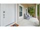 Front porch with two chairs, door and welcome mat at 6439 Taylor Ct, New Port Richey, FL 34653