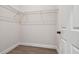 Walk-in closet with wire shelving and neutral walls at 6439 Taylor Ct, New Port Richey, FL 34653