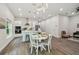 Bright dining area with white table and chairs at 6439 Taylor Ct, New Port Richey, FL 34653