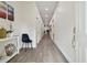 Bright hallway with wood-look floors at 6439 Taylor Ct, New Port Richey, FL 34653