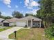 Newly built home with a single-car garage and welcoming front porch at 6439 Taylor Ct, New Port Richey, FL 34653