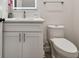 Clean bathroom with white vanity, toilet and updated fixtures at 6439 Taylor Ct, New Port Richey, FL 34653