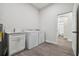 Laundry room with washer, dryer, sink, and access to bathroom at 6439 Taylor Ct, New Port Richey, FL 34653