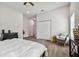 Well-lit bedroom with a comfortable sitting area and hardwood floors at 6439 Taylor Ct, New Port Richey, FL 34653