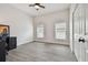 Bright home office features wood-look floors, built-in desk, and ample natural light at 6439 Taylor Ct, New Port Richey, FL 34653