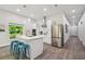 Open kitchen with island and stainless steel appliances at 6439 Taylor Ct, New Port Richey, FL 34653