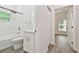 Clean bathroom with white vanity, tub, and shower at 6439 Taylor Ct, New Port Richey, FL 34653