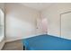 Bedroom with blue bed, wood-look floors, and window at 6439 Taylor Ct, New Port Richey, FL 34653