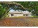 Large backyard with mature trees and a chain link fence at 6439 Taylor Ct, New Port Richey, FL 34653