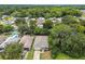 Aerial view of the house nestled amongst lush greenery at 6439 Taylor Ct, New Port Richey, FL 34653