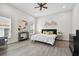 Spacious bedroom with large windows and ceiling fan at 6439 Taylor Ct, New Port Richey, FL 34653