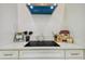 Sleek kitchen countertop with electric cooktop and stylish accents at 6439 Taylor Ct, New Port Richey, FL 34653