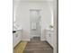 Double vanity bathroom with white cabinets and a large mirror at 6439 Taylor Ct, New Port Richey, FL 34653
