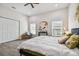 Bright bedroom featuring a king-size bed and ample closet space at 6439 Taylor Ct, New Port Richey, FL 34653