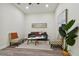 Small living room with gray sofa and armchairs at 6439 Taylor Ct, New Port Richey, FL 34653