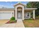 Front porch with two chairs and a door at 6439 Taylor Ct, New Port Richey, FL 34653