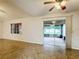 Living area with patio doors and a view of the backyard at 2106 Redleaf Dr, Brandon, FL 33510