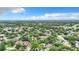 Aerial view showing houses surrounded by abundant trees and landscaping at 5001 80Th Avenue E Cir, Sarasota, FL 34243