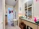 View of bathroom with double vanity and large mirror at 5001 80Th Avenue E Cir, Sarasota, FL 34243