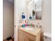 Small bathroom with single sink and granite countertop at 5001 80Th Avenue E Cir, Sarasota, FL 34243