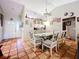 Spacious dining area with glass-top table and six chairs at 5001 80Th Avenue E Cir, Sarasota, FL 34243