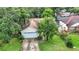 Aerial view of a house with a large yard and surrounding neighborhood at 5001 80Th Avenue E Cir, Sarasota, FL 34243