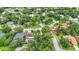 Neighborhood view showcasing various homes and lush greenery at 5001 80Th Avenue E Cir, Sarasota, FL 34243