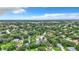Aerial view of a lush, tree-lined neighborhood with single-Gathering homes at 5001 80Th Avenue E Cir, Sarasota, FL 34243