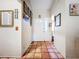 Bright entryway with terracotta tile floors and access to other rooms at 5001 80Th Avenue E Cir, Sarasota, FL 34243