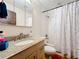 Clean bathroom with tub, shower, and updated vanity at 5001 80Th Avenue E Cir, Sarasota, FL 34243