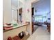 Vanity with mirror, view into bedroom, and additional storage at 5001 80Th Avenue E Cir, Sarasota, FL 34243