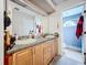 Double vanity bathroom with wood cabinets at 5001 80Th Avenue E Cir, Sarasota, FL 34243