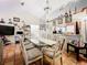 Dining area with glass-top table, six chairs, and views to kitchen at 5001 80Th Avenue E Cir, Sarasota, FL 34243