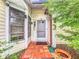 Front entry with terracotta tile flooring and access to interior rooms at 5001 80Th Avenue E Cir, Sarasota, FL 34243