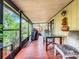 Covered patio with seating area and a view of the backyard at 5001 80Th Avenue E Cir, Sarasota, FL 34243