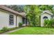 View of the home's entrance and walkway with landscaping at 5001 80Th Avenue E Cir, Sarasota, FL 34243