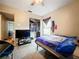 Bedroom with blue bedding, closet and TV at 5001 80Th Avenue E Cir, Sarasota, FL 34243