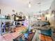 Living room with sofa, coffee table, and views to dining area at 5001 80Th Avenue E Cir, Sarasota, FL 34243