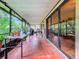 Spacious screened-in porch, perfect for outdoor dining at 5001 80Th Avenue E Cir, Sarasota, FL 34243