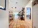Open living space with dining area and view of Primary bedroom at 5001 80Th Avenue E Cir, Sarasota, FL 34243
