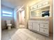 Bright bathroom features a tiled shower, sleek vanity, and modern fixtures at 1109 Belcher Rd, Palm Harbor, FL 34683