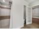 Bathroom with decorative tile shower and separate water closet at 1109 Belcher Rd, Palm Harbor, FL 34683