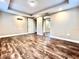 Spacious bedroom featuring wood floors and a large mirrored closet at 1109 Belcher Rd, Palm Harbor, FL 34683