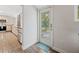 Entryway leading into the kitchen with stainless appliances at 1109 Belcher Rd, Palm Harbor, FL 34683