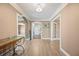Bright foyer featuring tile floors, arched doorways, and elegant trim details at 1109 Belcher Rd, Palm Harbor, FL 34683
