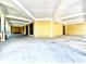 Spacious covered front porch with wooden columns and tongue-and-groove ceiling at 1109 Belcher Rd, Palm Harbor, FL 34683
